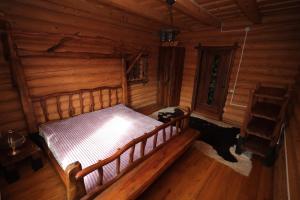 an overhead view of a bedroom in a log cabin at Приватна садиба Дикий Мед in Ploskoye +72 photos