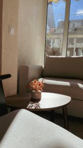 a living room with a couch and a table at Atrium Apartments Aachen in Aachen
