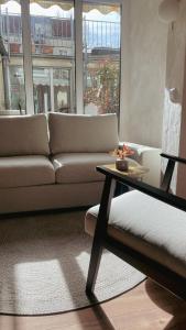 a living room with a couch and a table at Atrium Apartments Aachen in Aachen