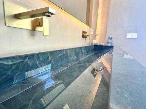 a lobby with a marble counter top and a sink at Luxury Cathedral Views in Seville in Seville