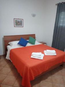 Tempat tidur dalam kamar di Casa di Cristina