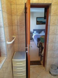 a door to a room with a bed and a bedroom at Animari Apartments in Stari Grad