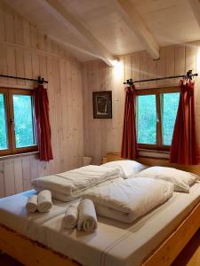 a bedroom with two beds with towels on them at Glamping-Paradies am Dengler Hof in Hohenberg an der Eger