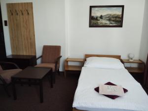 Postel nebo postele na pokoji v ubytování Hotel Lux