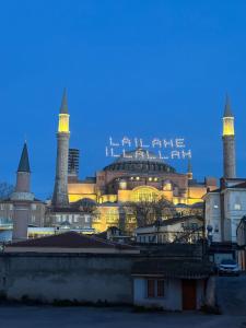 a building with two towers with a city in the background at Anadolu Hotel in Istanbul