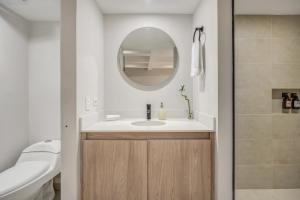 a bathroom with a sink and a mirror at Mohk Boutique by HOUSY HOST in Medellín