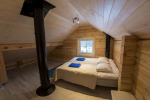 Postel nebo postele na pokoji v ubytování Hapsal Forest Cabin