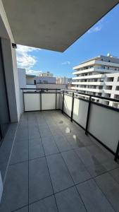an apartment balcony with a view of a city at AR ALBELLI HOUSE II in Košice