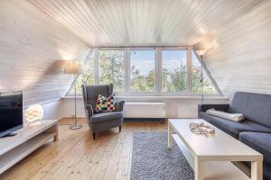 Χώρος καθιστικού στο Reetgedecktes Traumhaus mit Panorama-Ostseeblick