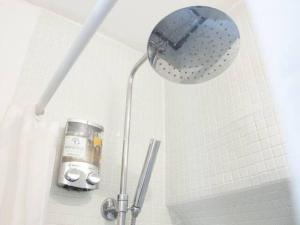 a shower in a bathroom with a shower head at Centre Palais des Papes B2 Clim - 123Avignon in Avignon