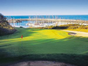 a view of a golf course with a bridge at So Cosy Beach in Talmont