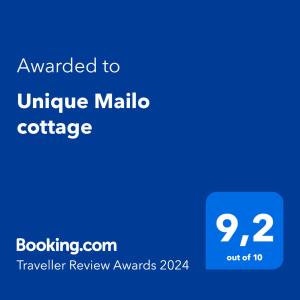 Unique Mailo cottage tesisinde sergilenen bir sertifika, ödül, işaret veya başka bir belge
