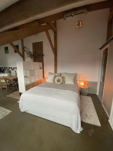 En eller flere senge i et værelse på B&B / Studio De Rozeboom