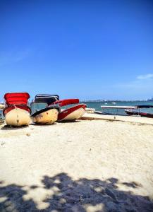 a group of boats parked on the beach at La Caracola Cartagena in Cartagena de Indias