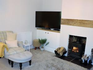 TV a/nebo společenská místnost v ubytování Manor Farm Cottage - Pet friendly