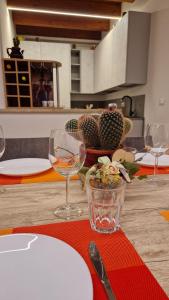 a table with wine glasses and a plate on it at Dai cugini del Garda in Salò +56 photos