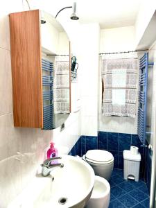 a bathroom with a sink and a toilet at La Dimora Del Cuore in Montelupo Fiorentino