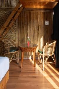 a room with a table and two chairs at Bayview Resort in Anjuna