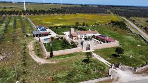 an aerial view of a large house in a field at Masseria Santu Lasi in Surbo