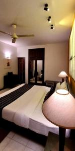 Postel nebo postele na pokoji v ubytování LUMBINI home stay + 10 fotografií