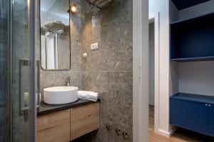 a bathroom with a sink and a mirror at Modern, 2 bedroom apartment in Hvar +24 photos