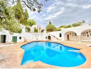 a swimming pool in the backyard of a house at Lella Zohra, Studio avec Piscine à Sidi Bou Said in Sidi Bou Saïd