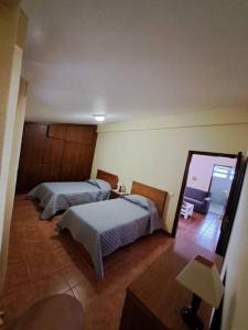 En eller flere senge i et værelse på Betty House.