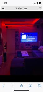 a living room with two couches and a television at Beautiful romantic apartment in Rotterdam in Rotterdam