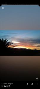 uno schermo con un'immagine di un tramonto di Los Sauces de la Fuente a Santillana del Mar