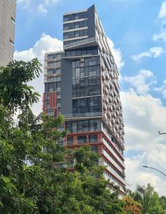 a tall building with trees in front of it at Dpto nuevo en Chapultepec in Guadalajara