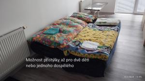 Postel nebo postele na pokoji v ubytování Apartmán na Vyhlídce