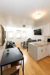 a living room with a couch and a table at Charming 2-Bed Apt Mins from NYC - Sleeps 7 in Union City