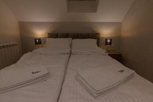 Letto o letti in una camera di Tara Lux apartmani