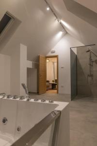 a bathroom with a sink and a shower at Tara Lux apartmani in Kaludjerske Bare