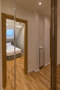 Letto o letti in una camera di Tara Lux apartmani
