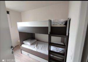 a bunk bed in a room with a bunk bedutenewayewayangering at Luxury Apartment in Ischia