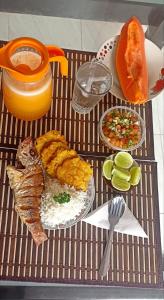 a table with a tray of food on a table at Hermosa casa ubicada en la playa in Termales - agua caliente - nuqui
