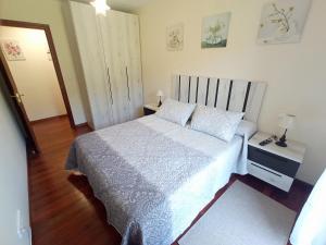 Postel nebo postele na pokoji v ubytování APARTAMENTO LAS FRAGUAS II + 6 fotografií