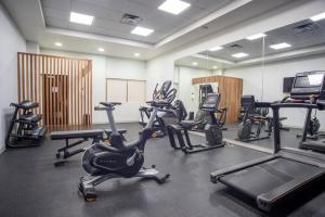 a gym with several treadmills and exercise bikes at Holiday Inn Express Guadalajara Iteso, an IHG Hotel in Guadalajara
