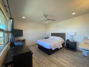 A bed or beds in a room at The Inn at Old Town