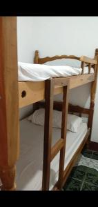 a couple of bunk beds in a room at Hostel Caballo Blanco in Moyogalpa