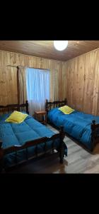 Una cama o camas en una habitación de Casa a 4 cuadras del centro de Pucon