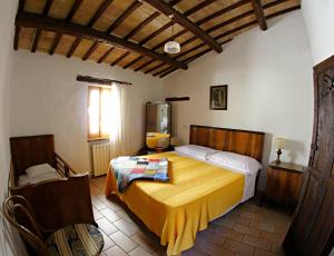 מיטה או מיטות בחדר ב-Agriturismo Residenza Paradiso