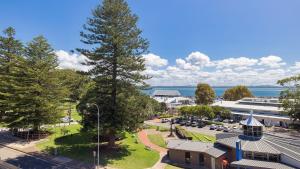 an overhead view of a town with a large tree at Nelson Bay CBD Apartment No 41 Nelson Towers in Nelson Bay