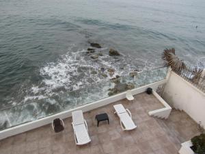a view of the ocean from the balcony of a house at Magia frente al Mar Caribe in Cartagena de Indias
