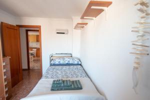 Posteľ alebo postele v izbe v ubytovaní An apartment in Xeraco with 3 bedrooms, located near beach and Gandia