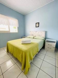 Krevet ili kreveti u jedinici u okviru objekta Casa de Praia Aconchegante e Próxima da Praia