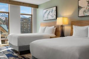 a hotel room with two beds and a window at Club Wyndham Resort at Avon in Avon