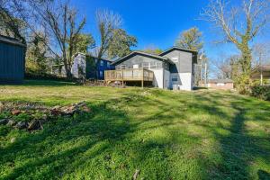 a house on a grassy hill with a yard at Oasis S-Kape near ATL airport! in Atlanta