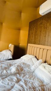 A bed or beds in a room at Sama Wadi Rum